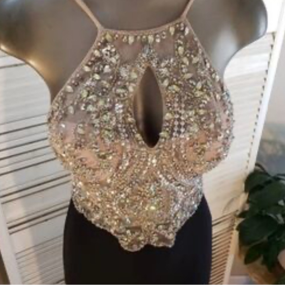 Elegant Beaded Evening Dress, long with slit on left leg, has padded pads.
